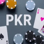 PKR Game poker chips and playing cards on table
